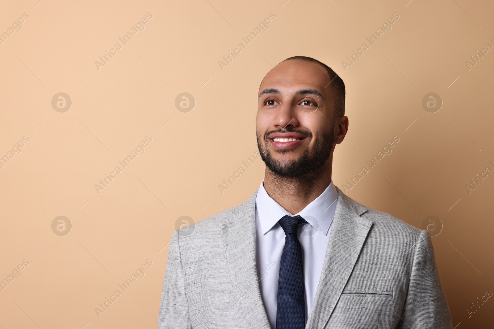 Photo of Portrait of businessman on beige background, space for text