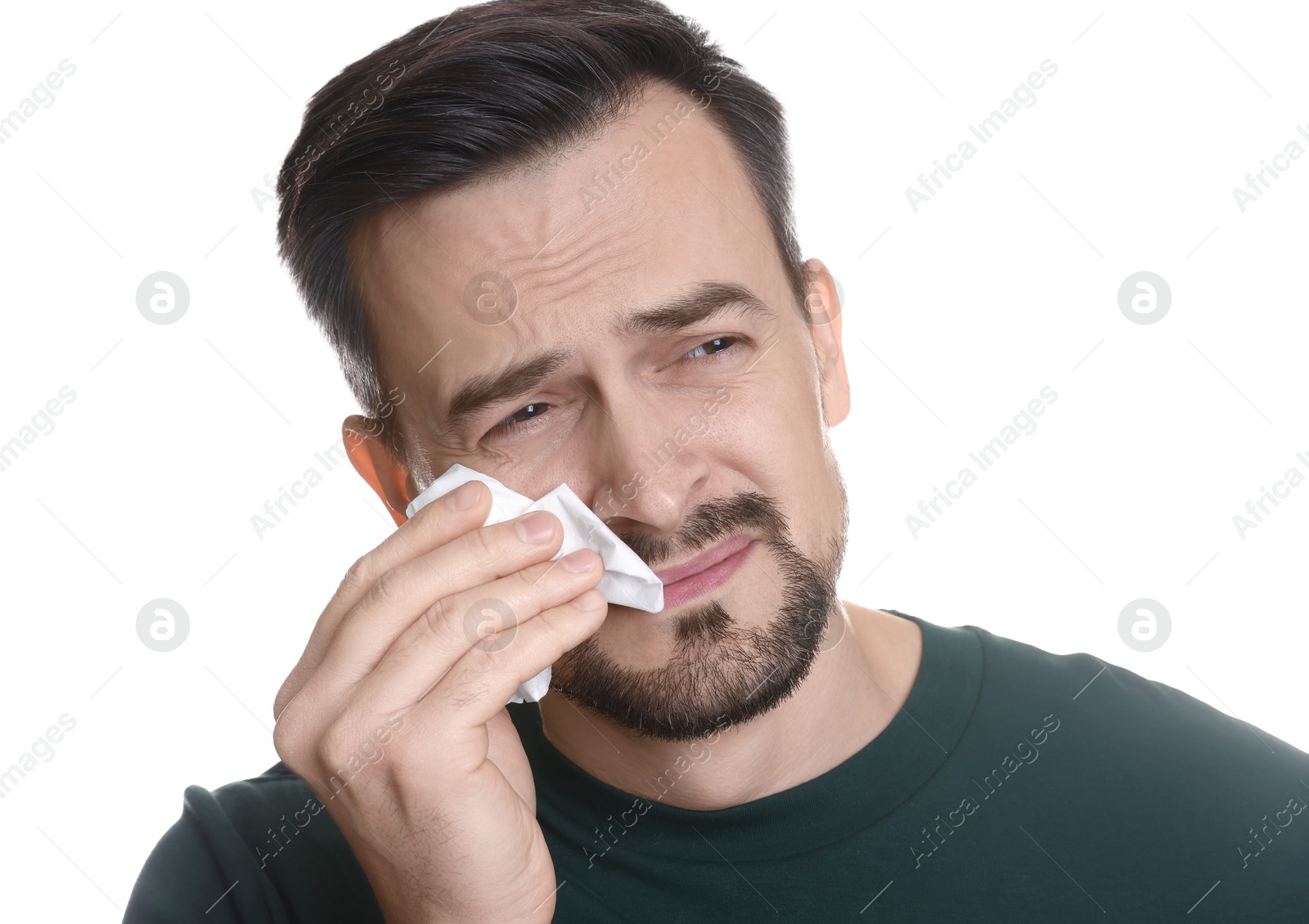 Photo of Sad man with paper tissue crying on white background