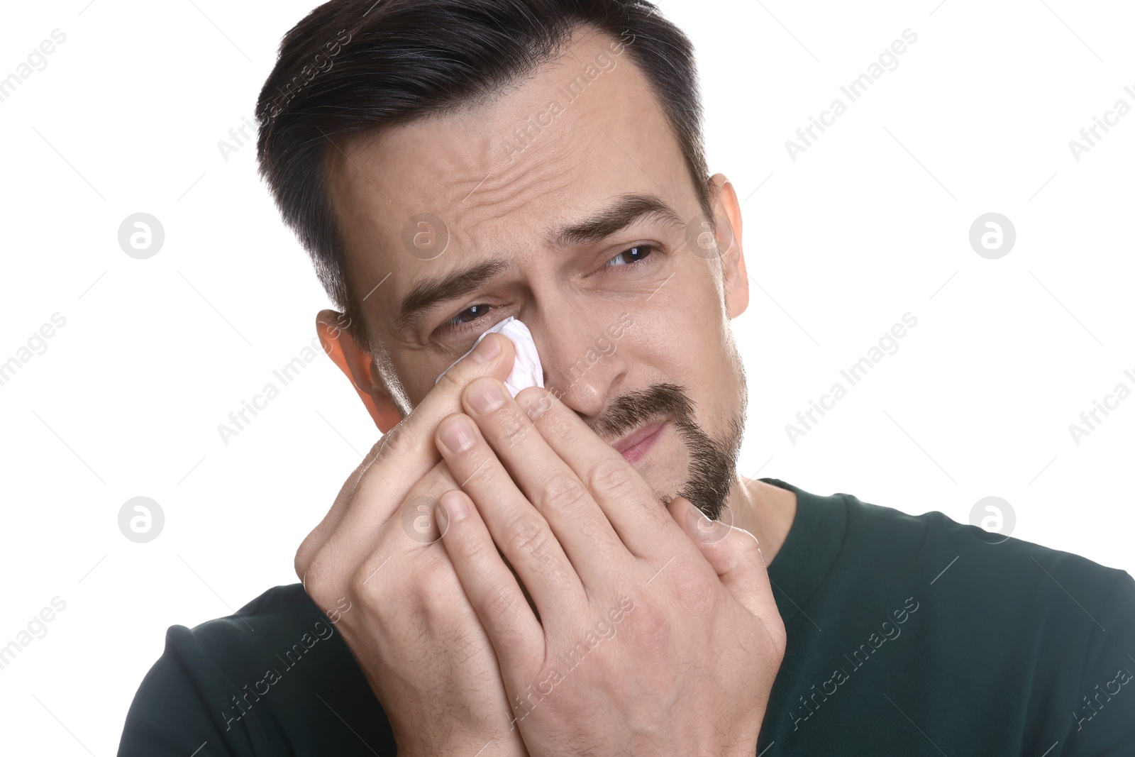 Photo of Sad man with paper tissue crying on white background