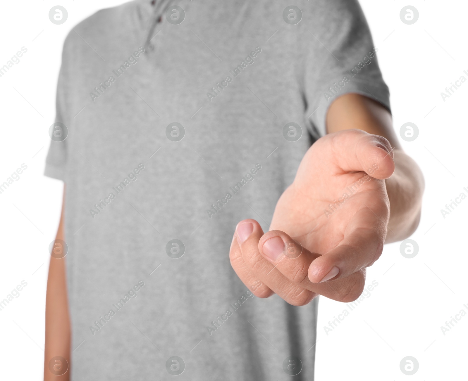 Photo of Offering help. Man reaching his hand on white background, closeup