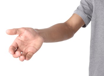 Photo of Offering help. Man reaching his hand on white background, closeup