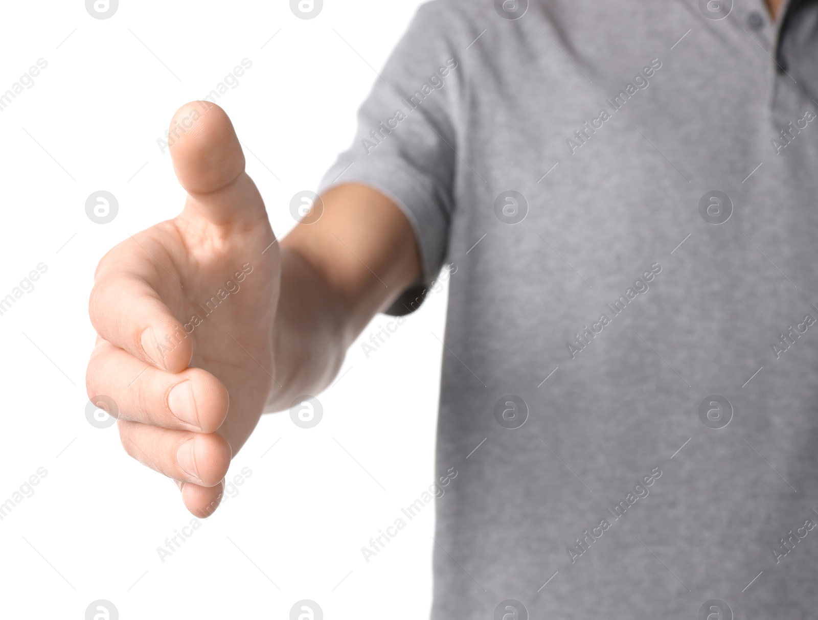 Photo of Offering help. Man reaching his hand on white background, closeup