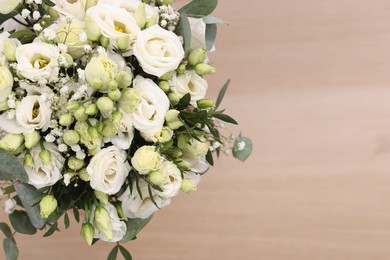 Photo of Beautiful wedding bouquet on light background, top view. Space for text