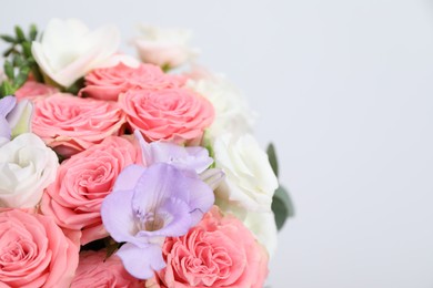 Photo of Beautiful wedding bouquet on light background, closeup. Space for text