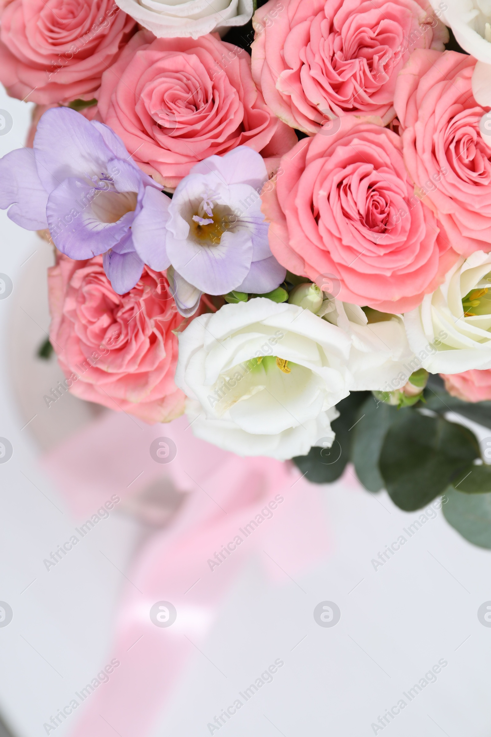 Photo of Beautiful wedding bouquet on light background, closeup. Space for text