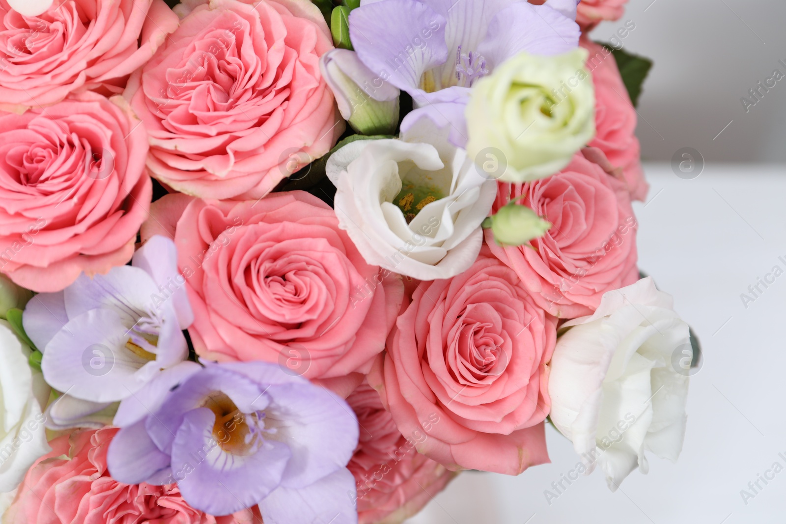 Photo of Beautiful wedding bouquet on light background, closeup