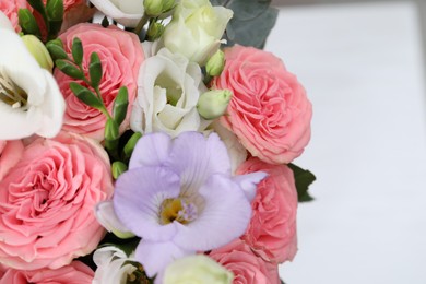 Photo of Beautiful wedding bouquet on light background, closeup. Space for text