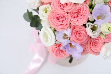 Photo of Beautiful wedding bouquet on light background, closeup. Space for text