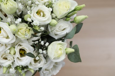 Photo of Beautiful wedding bouquet on light background, closeup. Space for text