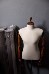 Photo of Many different types of fabric and mannequin in professional workshop