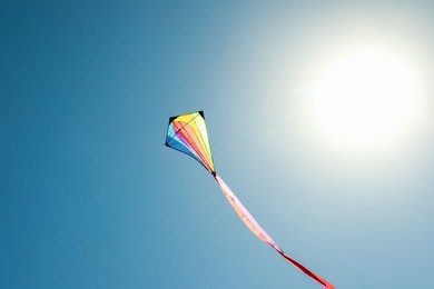 Photo of One colorful kite flying in sky on sunny day