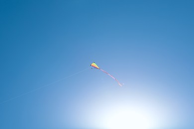 Photo of One colorful kite flying in sky on sunny day
