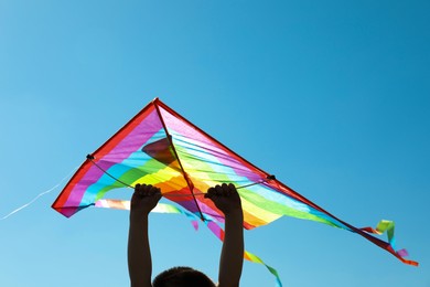 Photo of Boy with kite on sunny day, closeup