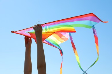 Photo of Woman with kite on sunny day, closeup
