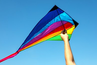 Photo of Man with kite on sunny day, closeup