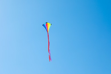 Photo of One colorful kite flying in blue sky