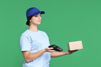 Photo of Girl in uniform with parcel and payment terminal on green background. Work for teenagers