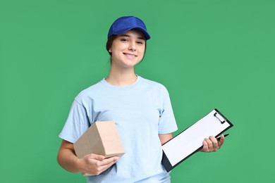 Photo of Girl in uniform with parcel and clipboard on green background. Work for teenagers