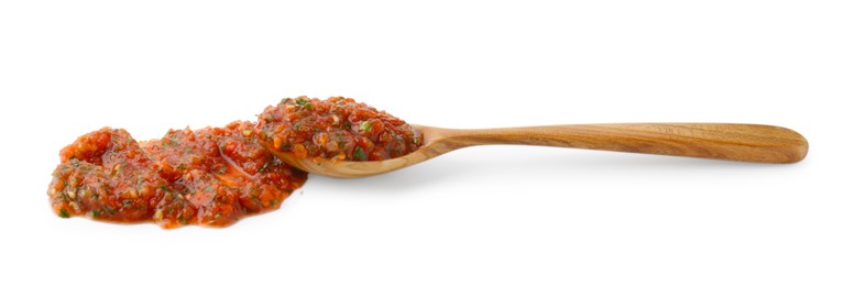 Photo of Tasty salsa sauce in spoon isolated on white