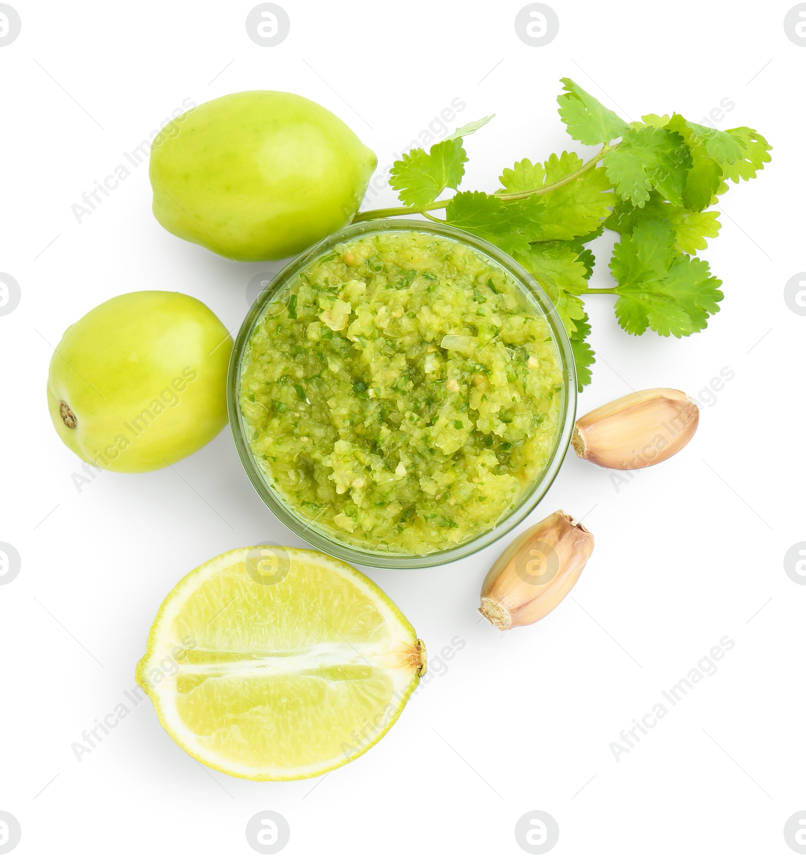 Photo of Delicious homemade green salsa and ingredients isolated on white, top view