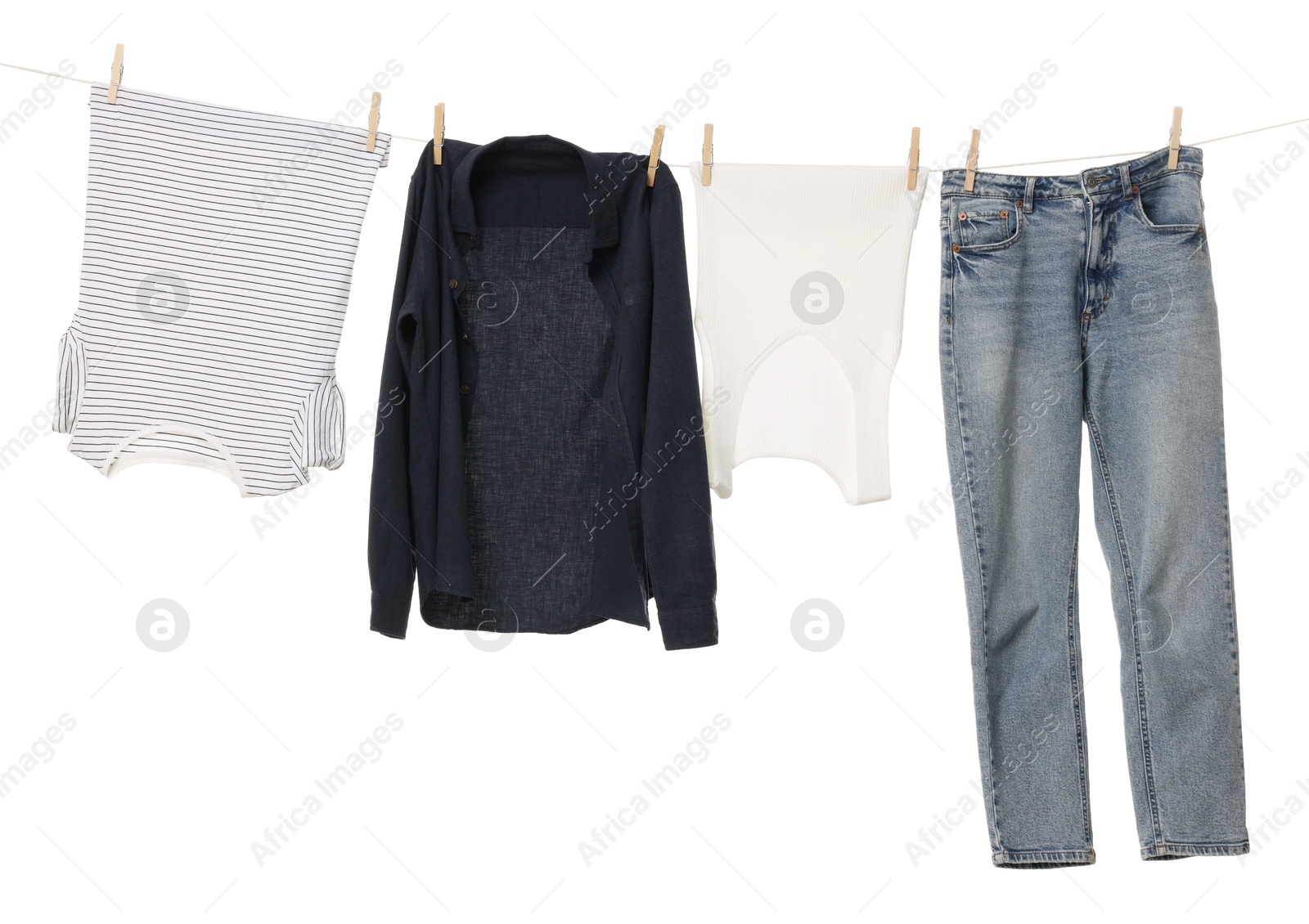 Photo of Different clothes drying on laundry line against white background