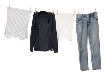 Photo of Different clothes drying on laundry line against white background