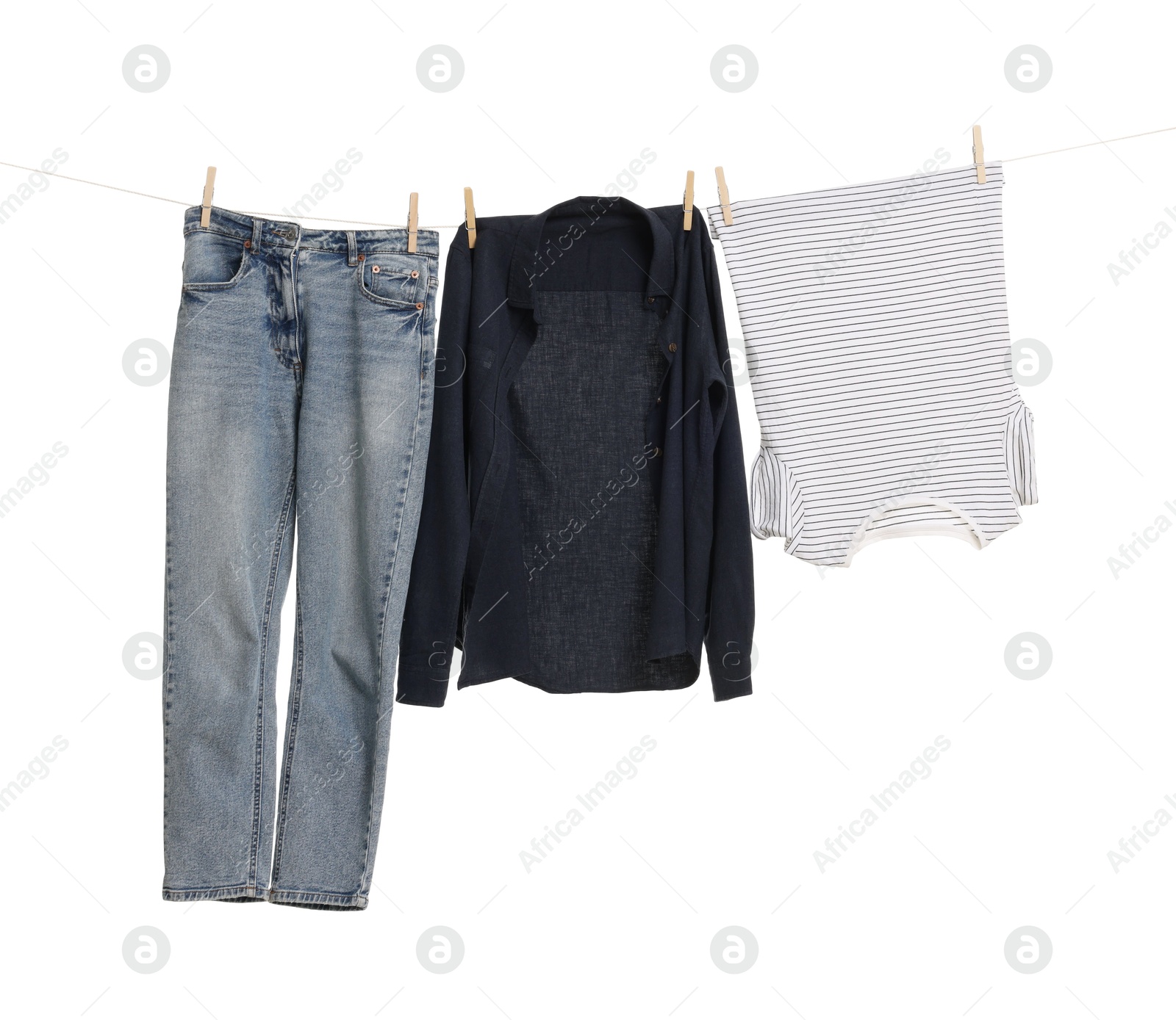 Photo of Different clothes drying on laundry line against white background