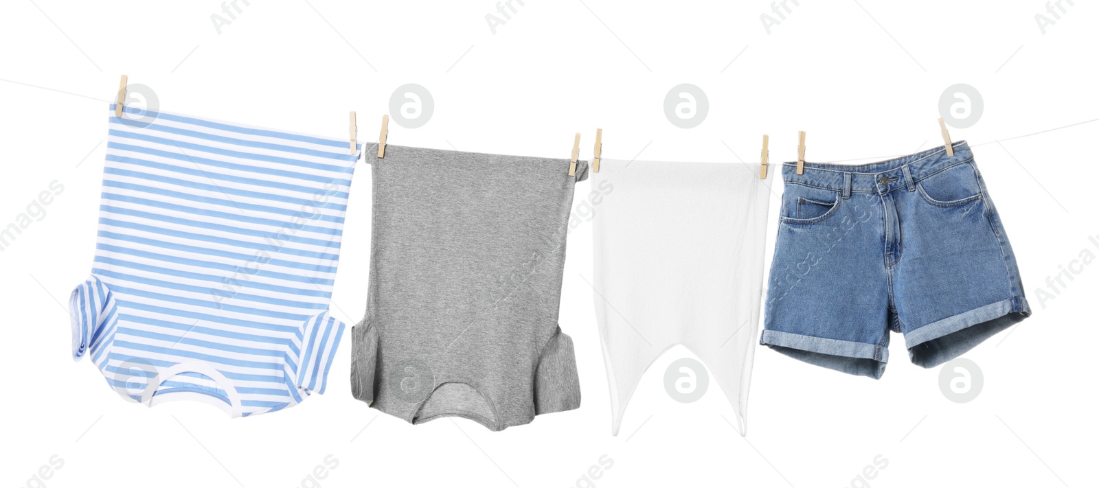 Photo of Different clothes drying on laundry line against white background