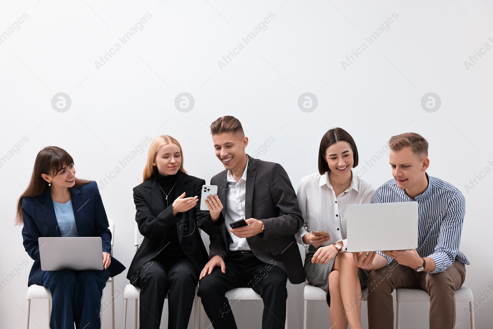 Photo of Group of people using different gadgets indoors. Modern technology