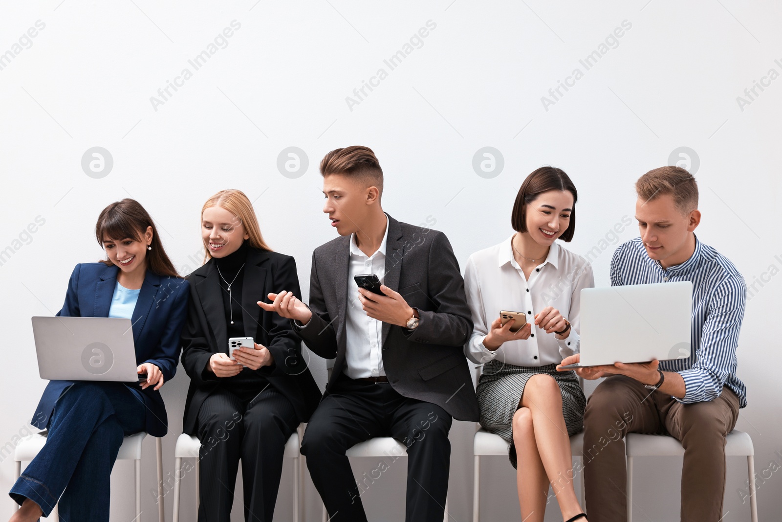 Photo of Group of people using different gadgets indoors. Modern technology