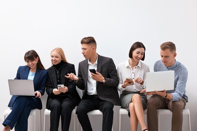 Photo of Group of people using different gadgets indoors. Modern technology