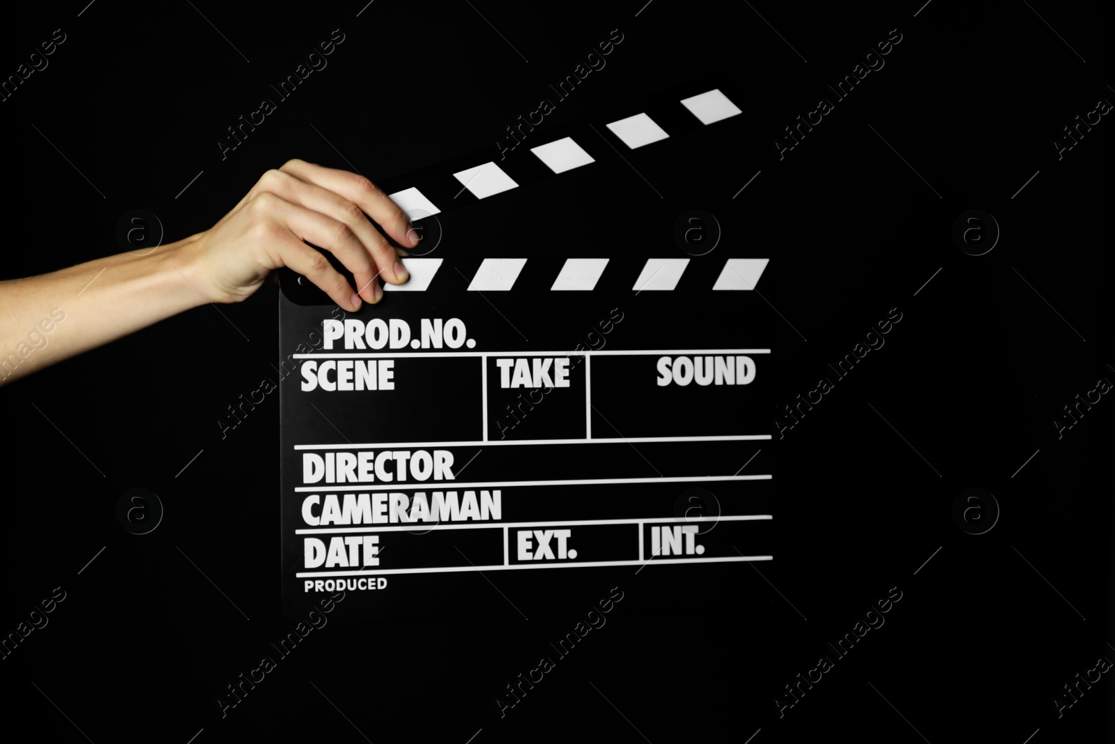 Photo of Woman with clapperboard on black background, closeup