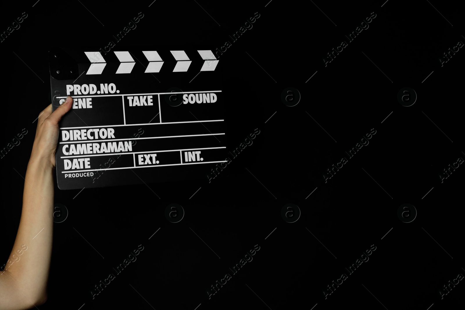 Photo of Woman with clapperboard on black background, closeup. Space for text