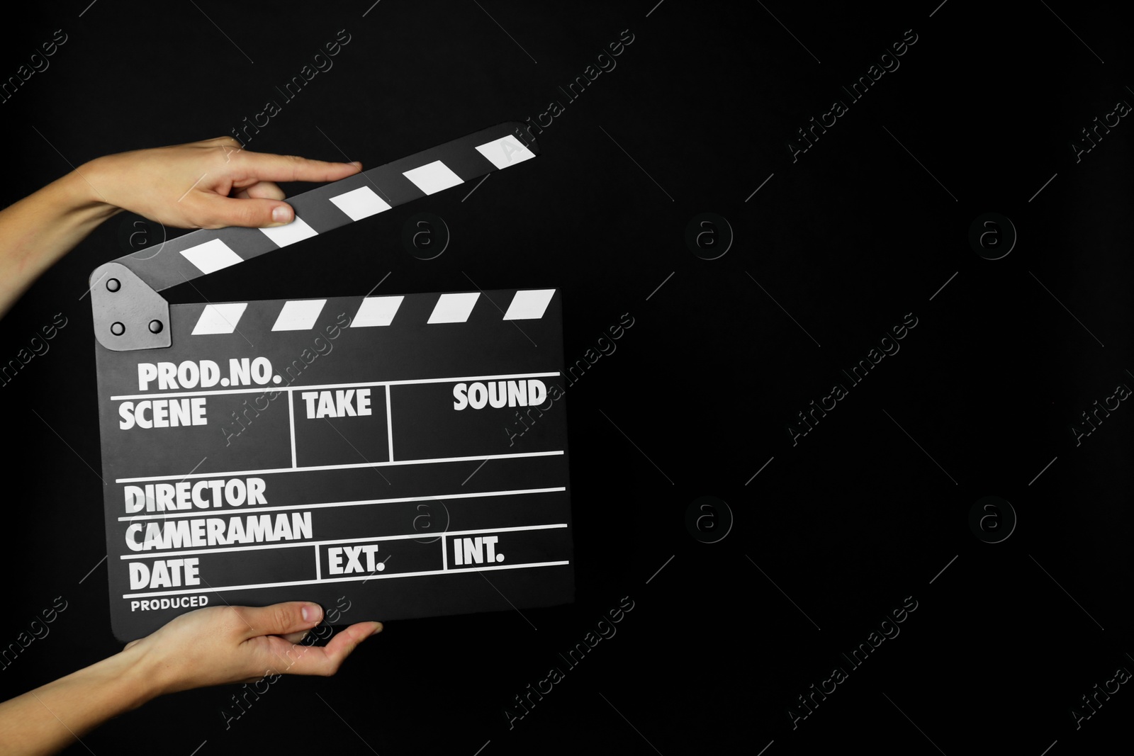 Photo of Woman with clapperboard on black background, closeup. Space for text