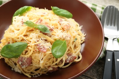 Photo of Delicious pasta Carbonara served on table, closeup