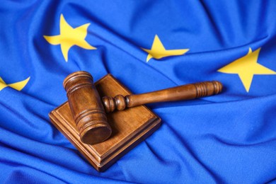 Photo of Judge's gavel on flag of European Union, closeup