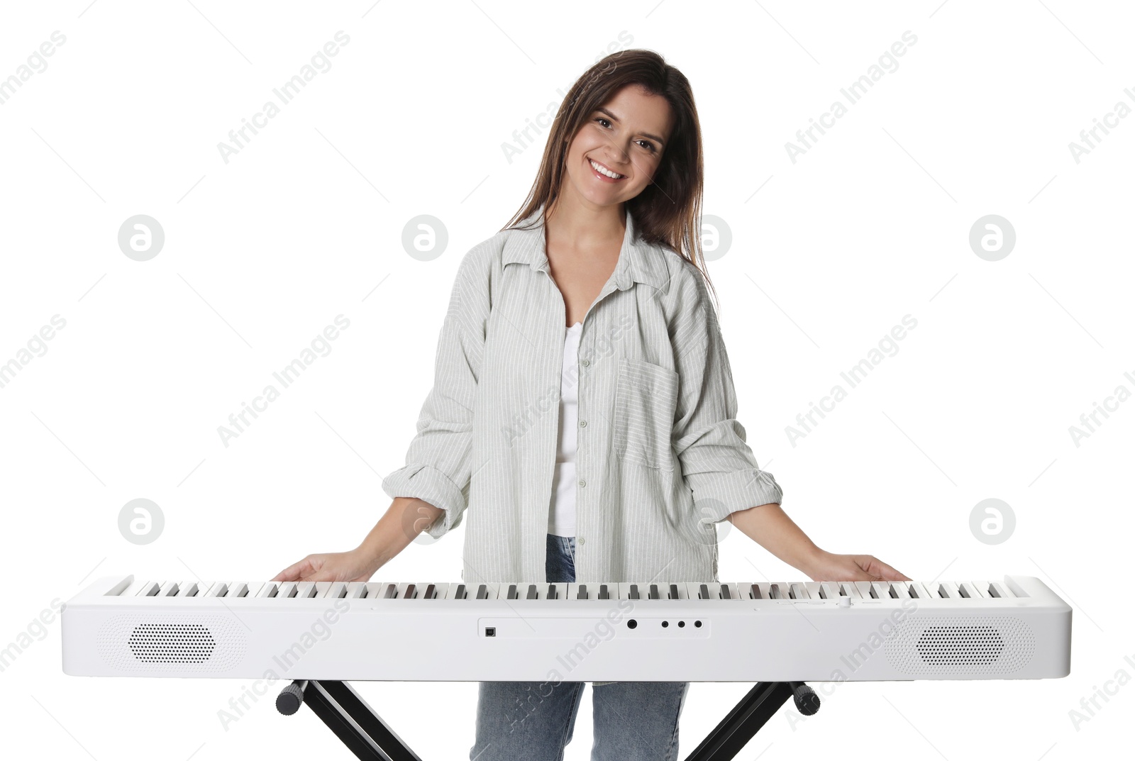 Photo of Smiling woman playing synthesizer on white background