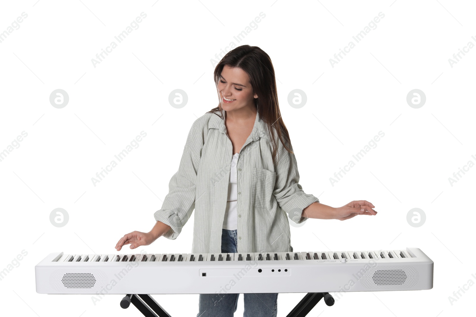 Photo of Smiling woman playing synthesizer on white background