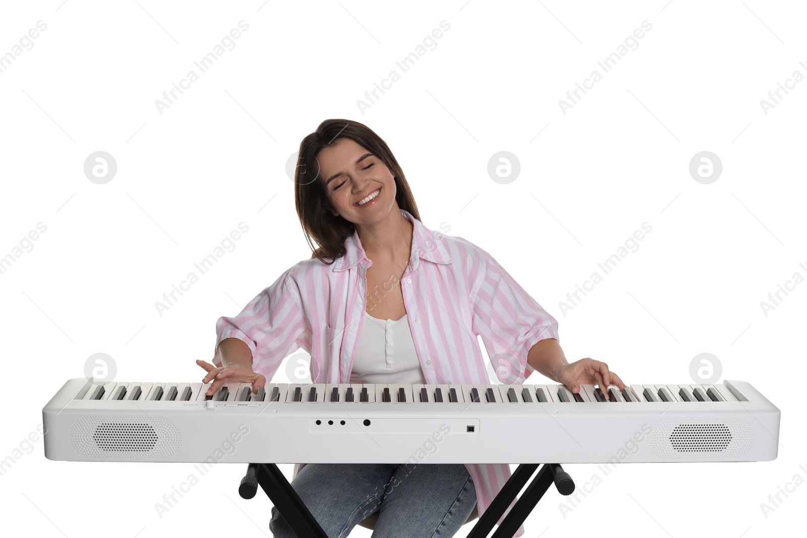 Photo of Smiling woman playing synthesizer on white background