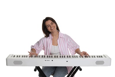 Photo of Smiling woman playing synthesizer on white background