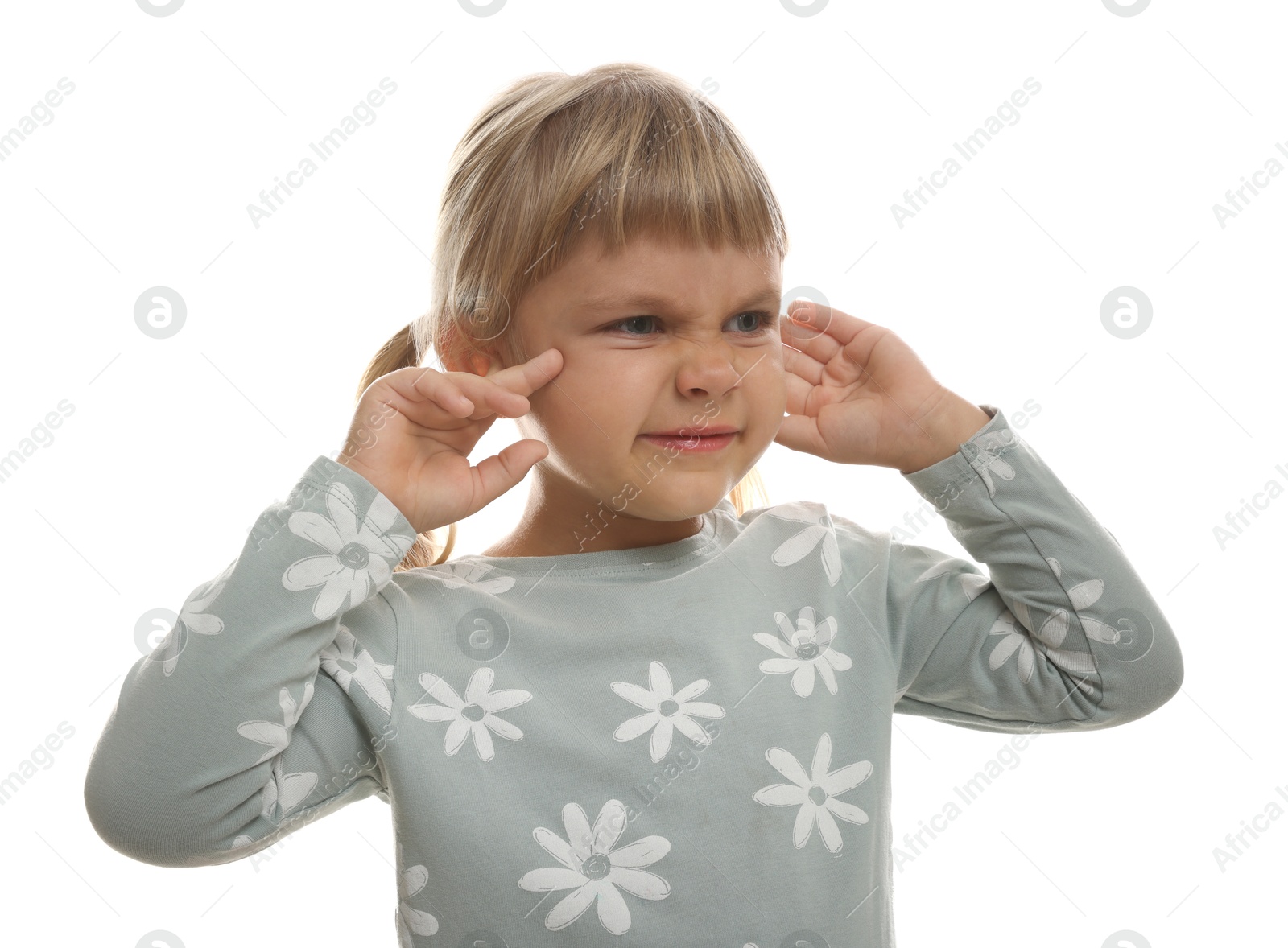 Photo of Little girl covering her ears with fingers on white background