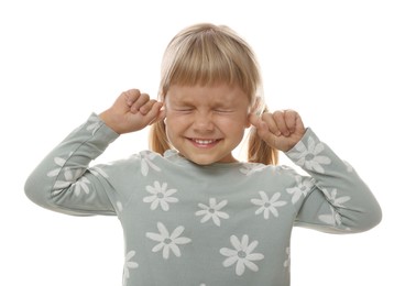 Photo of Little girl covering her ears with fingers on white background