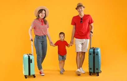 Photo of Travellers with suitcases. Happy family on yellow background