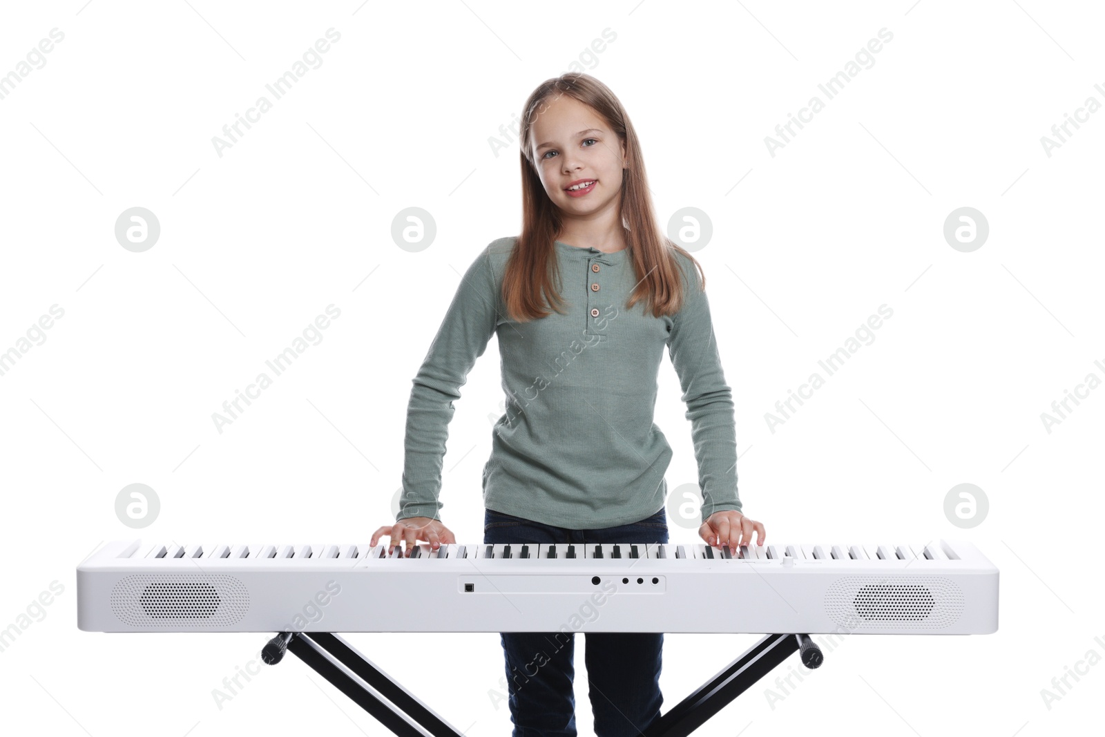 Photo of Cute girl playing synthesizer on white background