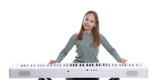 Photo of Cute girl playing synthesizer on white background