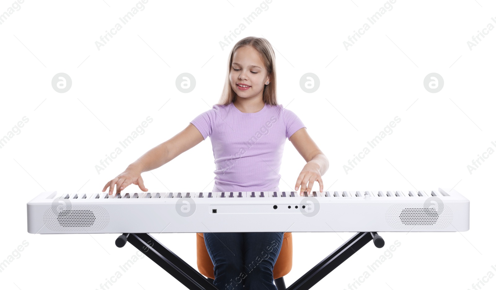 Photo of Cute girl playing synthesizer on white background