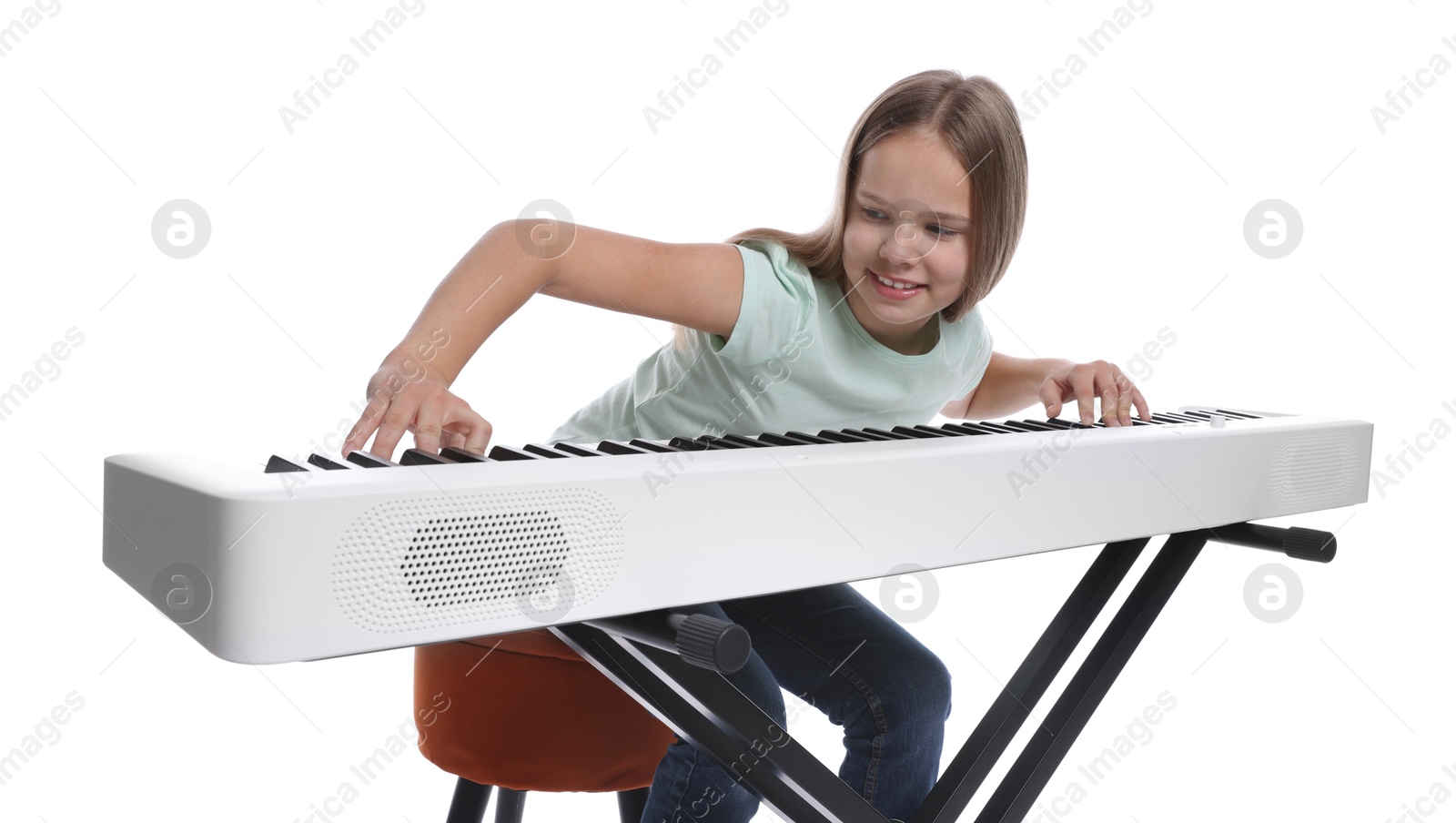 Photo of Cute girl playing synthesizer on white background