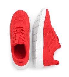 Photo of Pair of stylish red sneakers isolated on white, top view