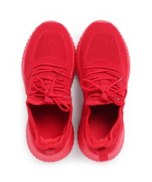 Photo of Pair of stylish red sneakers isolated on white, top view