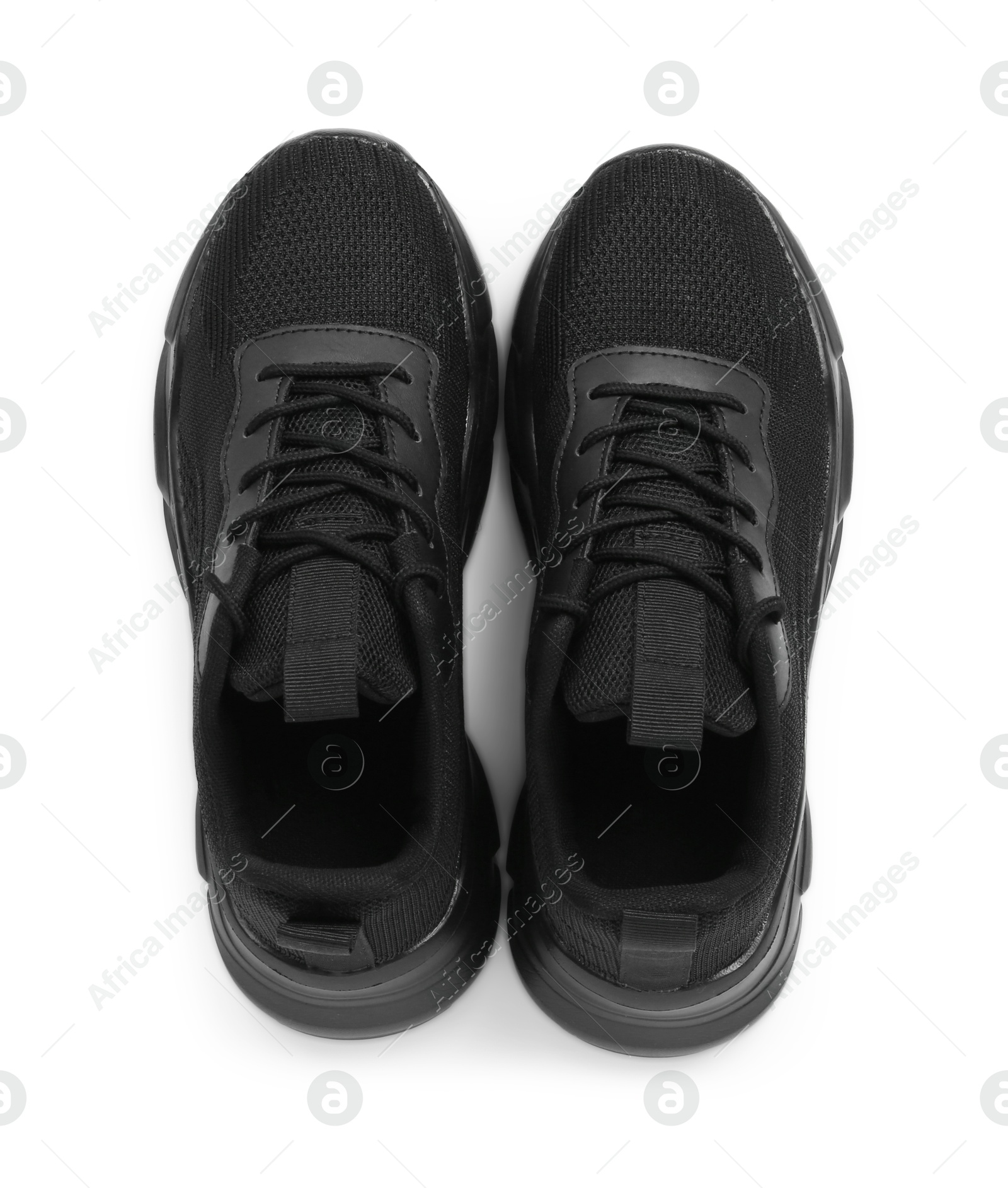 Photo of Pair of stylish black sneakers isolated on white, top view